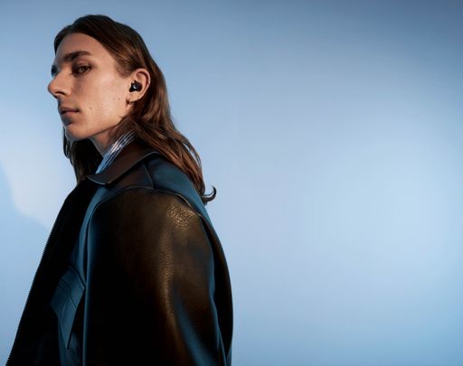 Urbanista Porto Midnight Black true wireless earbud lifestyle portrait