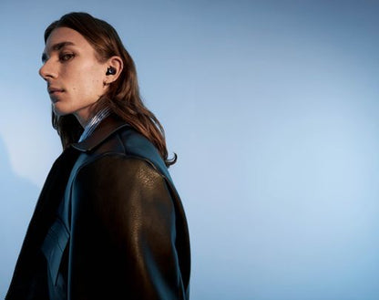 Urbanista Porto Midnight Black true wireless earbud lifestyle portrait